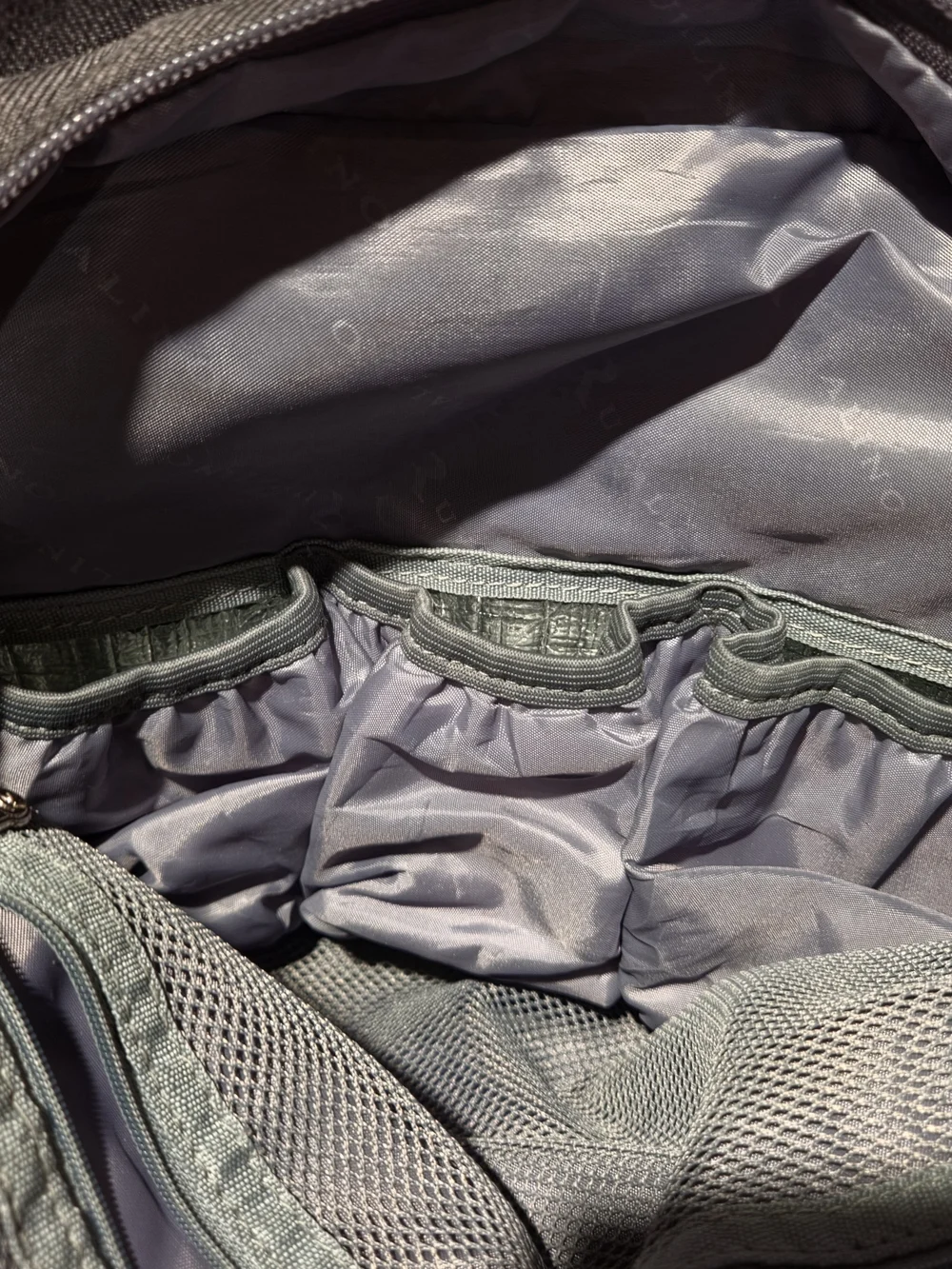 dark gray quilted Ruvalino diaper bag backpack.